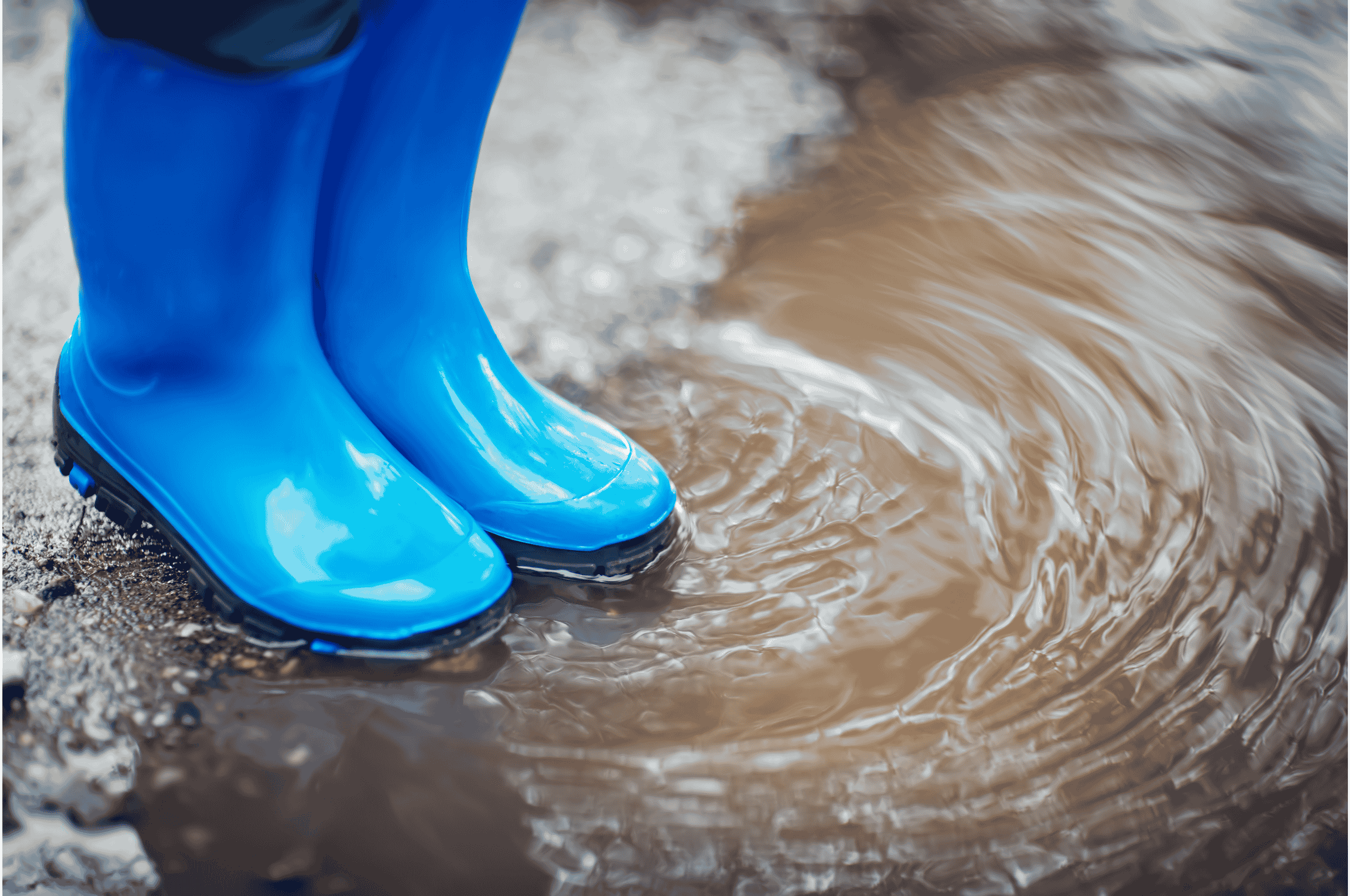 welly boots splashing in a puddle